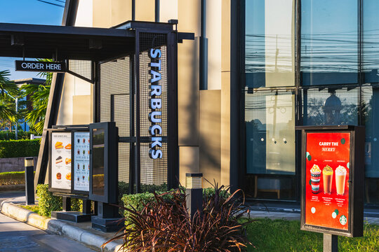 KANCHANABURI,THAILAND-December 31, 2020 : Drive thru sign of famous Starbuck Coffee shop service channel for selling fresh coffee and souvenirs and takeaway for buy fast food and beverage at TMK Park.