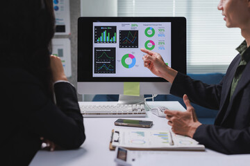 Business people analysing data during corporate meeting