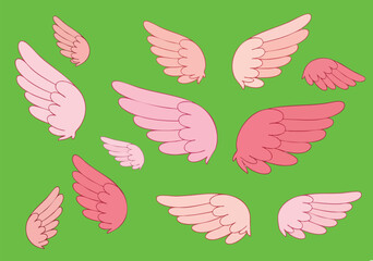 Naklejka premium Collection of various colored wings arranged in a scattered pattern on a green background