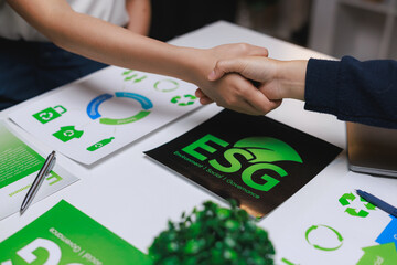 People shaking hands discussing global esg sustainability partnership
