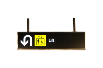 Sign for Elevator, Lift, Restroom, Handicap, Turn around at shopping mall or airport isolated on cutout PNG. Hanging from the ceiling to provide directions for tourists and travelers.
