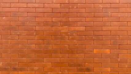Naklejka premium Red brick wall texture with clean pattern, ideal for backgrounds, architecture visuals, construction themes, and design mockups. Perfect for designers, advertisers, publishers, and educational content