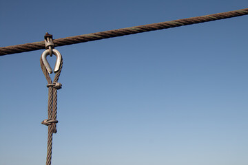 Detailed close-up of a steel sling emphasizing strength reliability and industrial design.