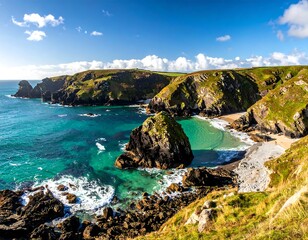 Sunny coastal landscape; turquoise water meeting rocky cliffs under a blue sky