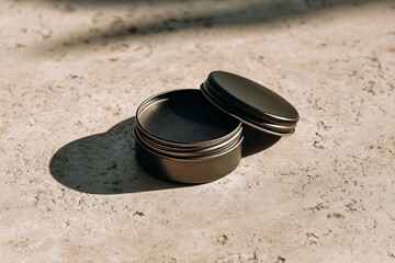 Small metal tin on sandy beach