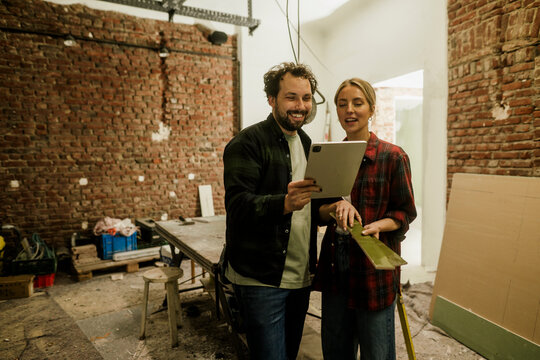 Two people planning renovation and energy consulting in old building