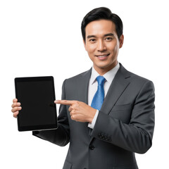 Smiling asian businessman in suit pointing to blank tablet screen isolated on transparent background