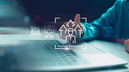 Close up of hand using laptop with Human Resources hologram interface, featuring recruitment, talent acquisition, and career growth icons for modern corporate management concept.