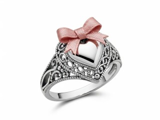 Closeup of ornate silver ring with pink bow and gemstone on finger isolated on white background for jewelry