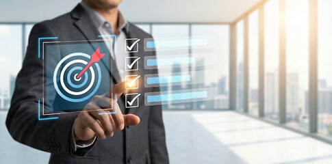 Business goal setting and task management. professional interacts with a digital checklist and...