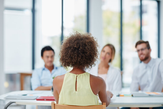Discussion, job interview and businesswoman in office for recruitment, vacancy or hiring opportunity. Meeting, back and candidate with human resources team for onboarding process in workplace.