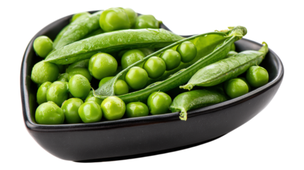 Black heart shaped bowl full of fresh raw green peas on transparent backdrop