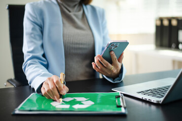 Corporate sustainability and recycling management concept with ESG reporting, green office workflow, digital tablet, and environmental responsibility