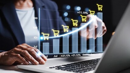 A businessman analyzes a rising sales graph on a laptop illuminated by shopping cart icons indicating positive e commerce growth and market trends - Powered by Adobe