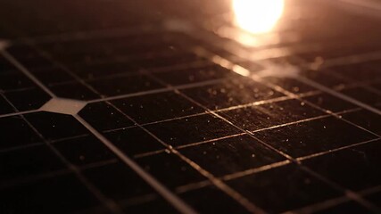 Close up of a solar panel cell with a bright light, renewable energy concept.