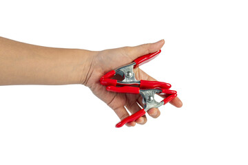 A studio shot of a red stainless spring clamp in hand isolated on a transparent background