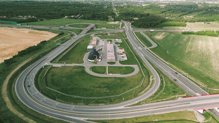 Highway loop exit in open rural field