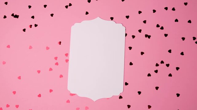 Empty decorative label surrounded by romantic heart shapes on pink for Valentine\'s Day