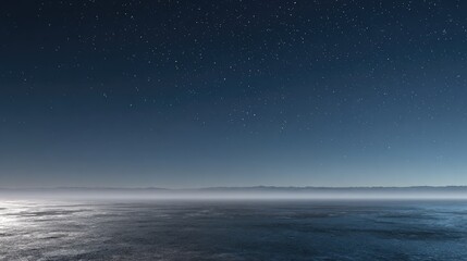 Starry night sky over misty ocean horizon