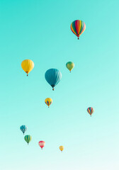 Fototapeta premium Bright sky background featuring vibrant hot air balloons floating gently
