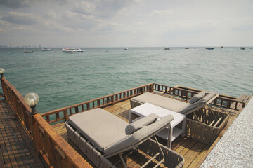 The couple seat relaxing with the ocean breeze
