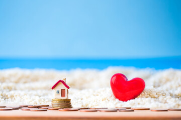 house on the beach with red heart 