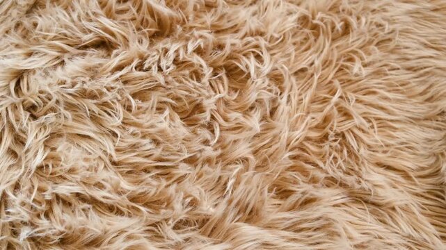 Soft fluffy brown faux fur texture detail close up warm cozy background