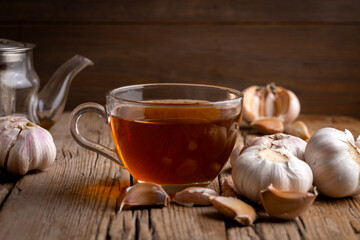 A cup of healthy garlic tea on the table