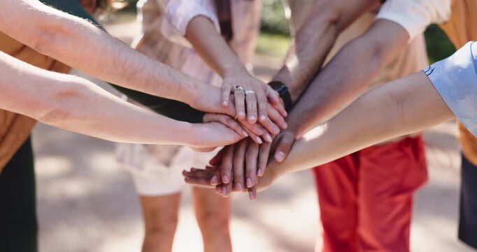 Teamwork, hands and stack with people outdoor for motivation, collaboration and support for hike. Friends, huddle and together with solidarity for exercise, wellness and bonding in nature for travel