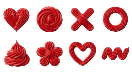 Red buttercream frosting set including hearts, roses, swirl, flower, and squiggle shapes isolated. Cake decorating and pastry design elements.
