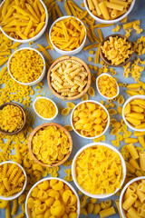 Composition with different tasty uncooked pasta - Italian pasta wallpaper, different types and shapes of pasta layout