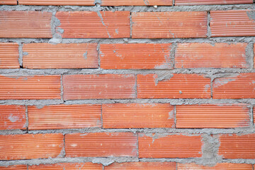 Fototapeta premium pattern of red rough brick wall
