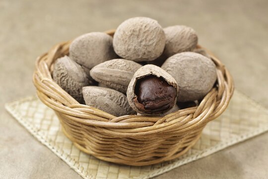 Kluwek also known as keluak, keluwak, or black nut - the seeds of the Pangium edule tree