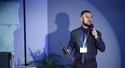 Male business speaker conducting seminar in office