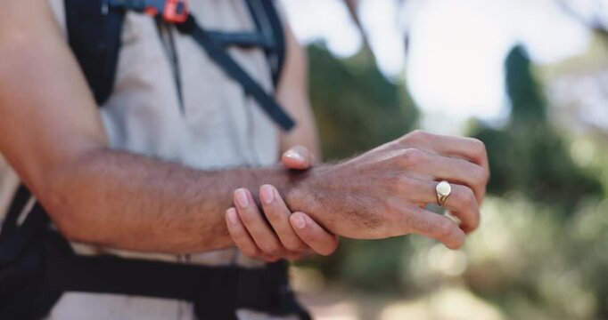 Hands, wrist pain and hiking in forest with injury, carpal tunnel or massage for tendinitis on adventure. Person, trekking and joint ache with inflammation, fatigue or burnout with arthritis in woods
