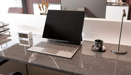 Modern office desk with laptop, coffee cup and digital clock