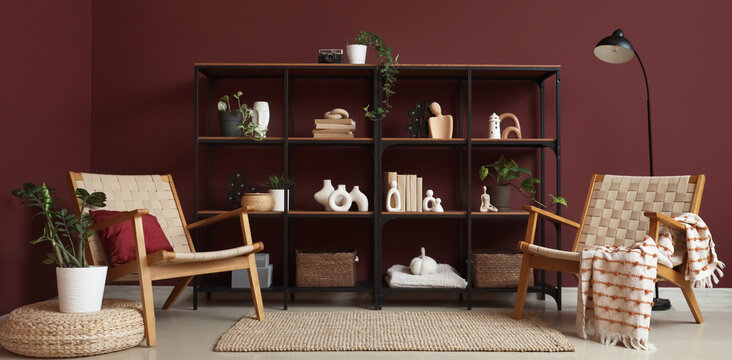 Interior of room with bookshelf, armchairs and lamp