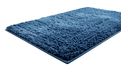Blue rectangular bath mat with soft, shaggy texture against a black backdrop