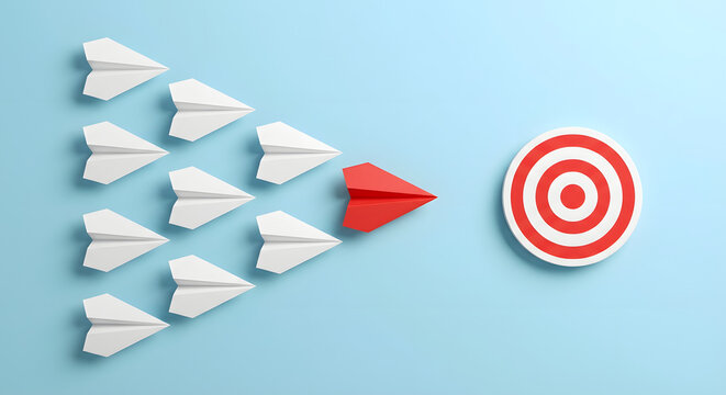 red paper plane leading a fleet of white planes toward a target bullseye on a blue background representing leadership teamwork strategic vision and business goal achievement