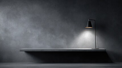 Minimal workstation with a floating shelf lit by a single desk lamp light cone softly fading into the