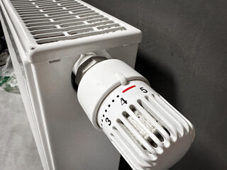 Close-up of a radiator with thermostat