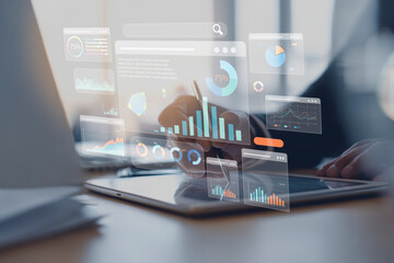 Professional analyzing business data and financial reports using a digital tablet with futuristic holographic charts and graphs overlayed