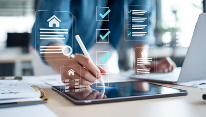 Person using stylus on tablet with holographic real estate and checklist icons, representing digital property management, smart home system, or online task completion.