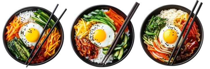 Korean bibimbap dish with fresh vegetables, fried egg, and gochujang sauce in black bowl isolated on white background