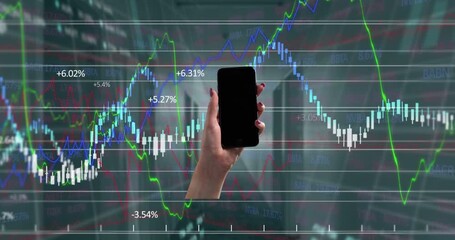Animation of hand of caucasian woman holding smartphone with copy space over financial graphs - Powered by Adobe