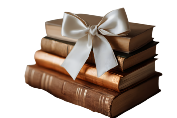 a stack of books with a white bow on top