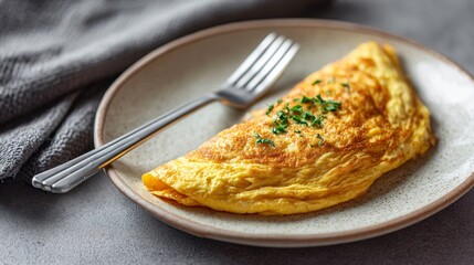 Soft omelette with uniform color, off-white ceramic plate, minimalist mood