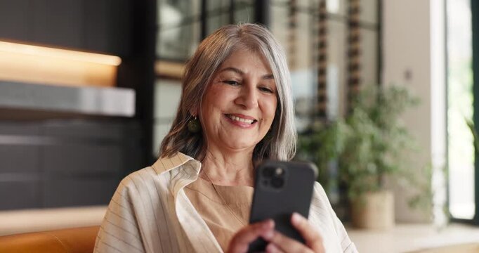 Sofa, reading or senior woman with phone in home, scroll social media or check message notification. Watch video, online pensioner blog or old person smile for retirement forum post, mobile or browse