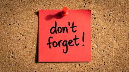Bright red reminder note affixed with a plastic thumbtack urgently communicates do not forget message.