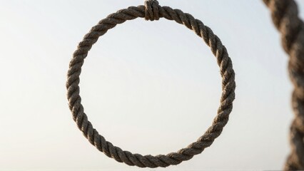 Rope loop with knot against calm sky